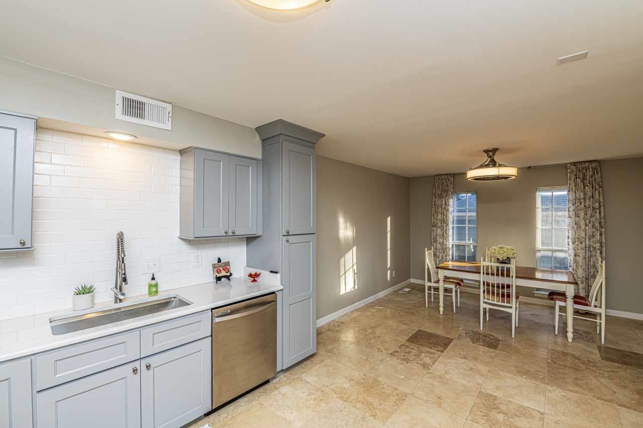 6910 Petworth Road, Unit 6910 Memphis, TN 38119 - Photo 7 of 37 a kitchen with a sink and chairs