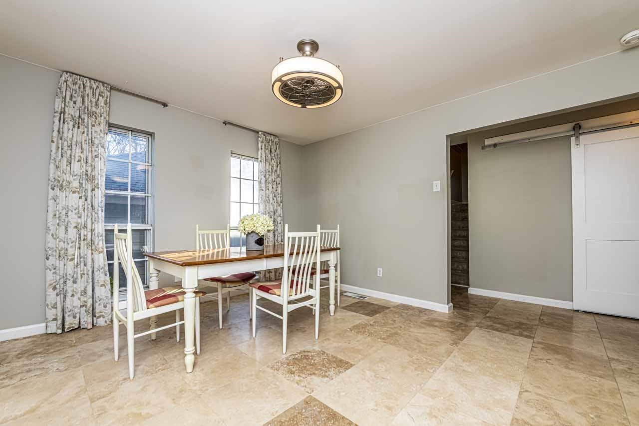 6910 Petworth Road, Unit 6910 Memphis, TN 38119 - Photo 10 of 37 a dining room with a wooden table and chairs