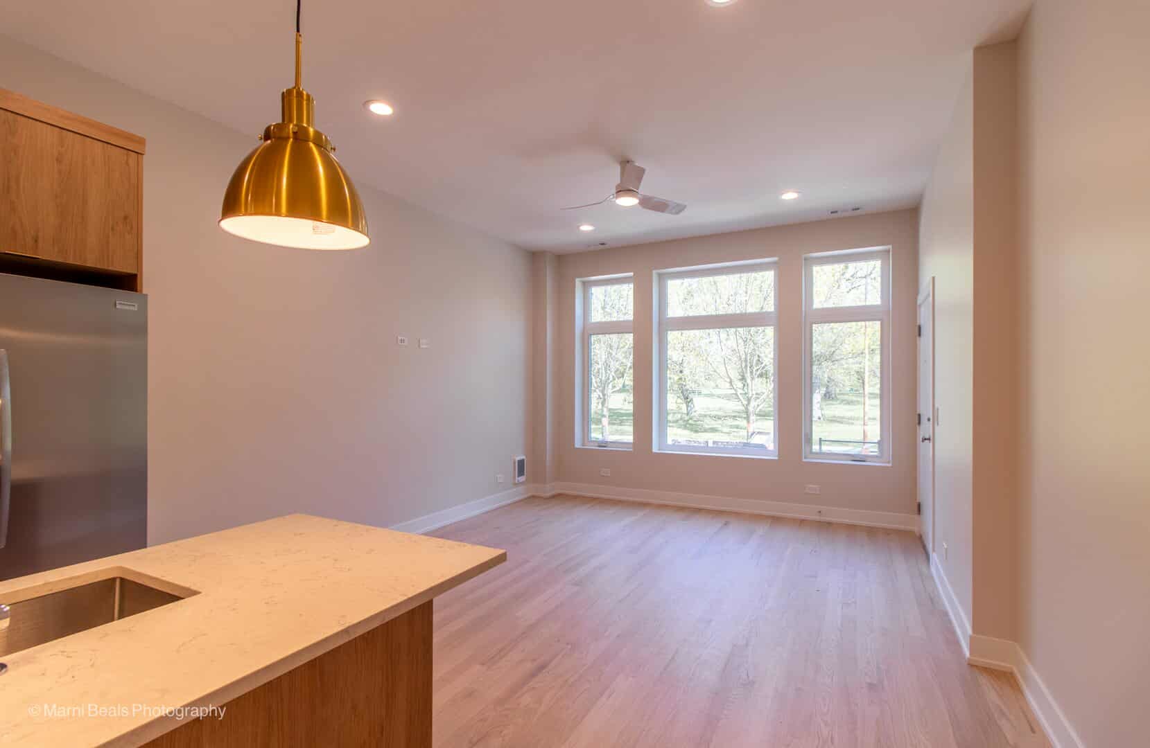 507 East 60th Street, Unit 1 Chicago, IL 60637 - Photo 6 of 15 a room with window and wooden floor