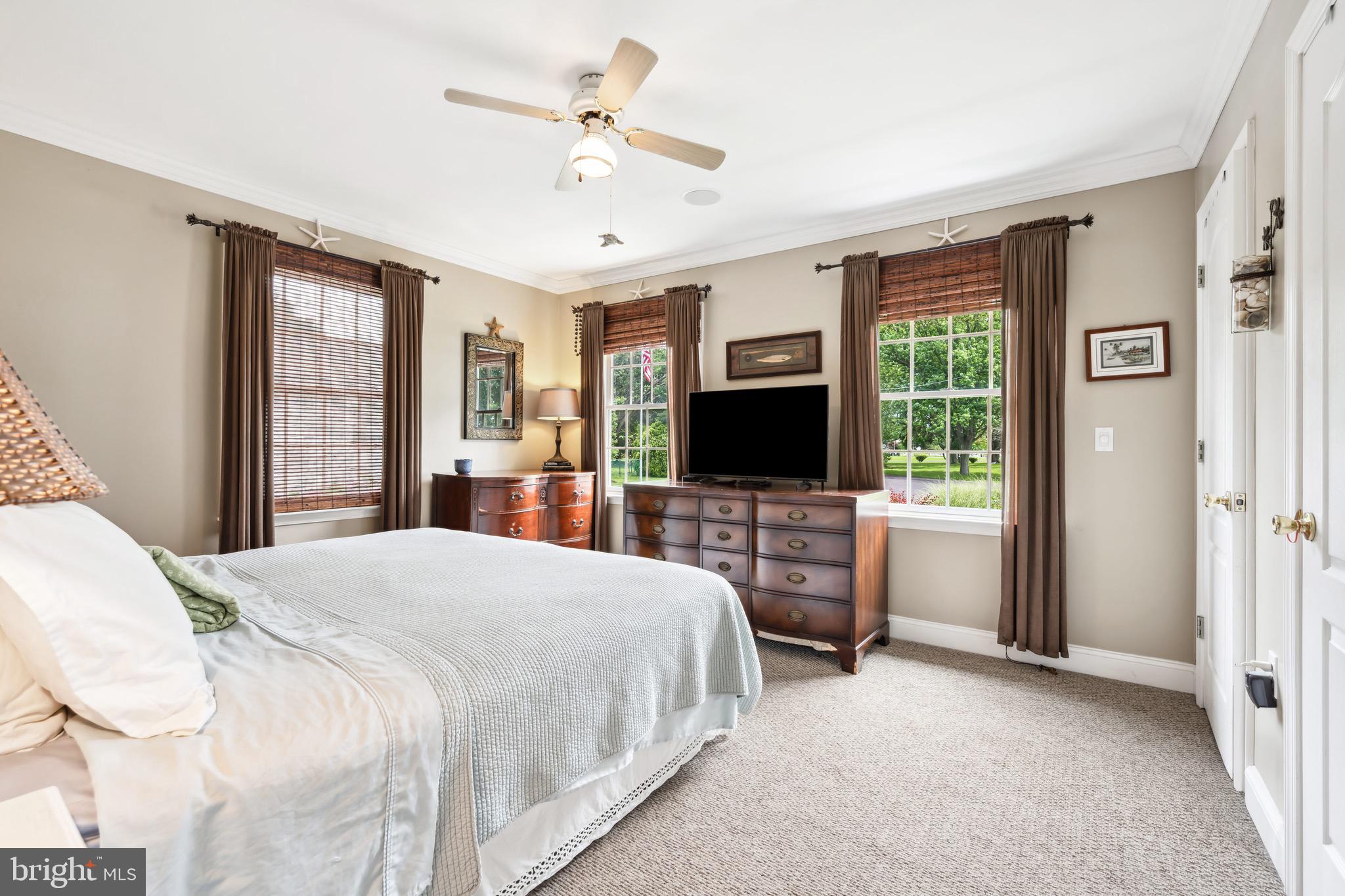 1606 Howard Road Chester, MD 21619 - Photo 18 of 54 a bedroom with a bed and a flat screen tv