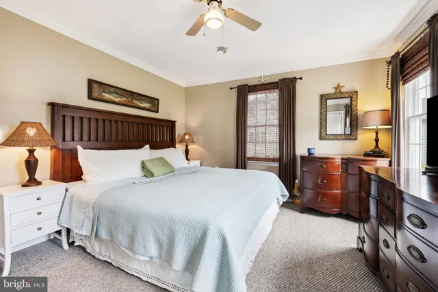 a bed room with a bed and a chandelier