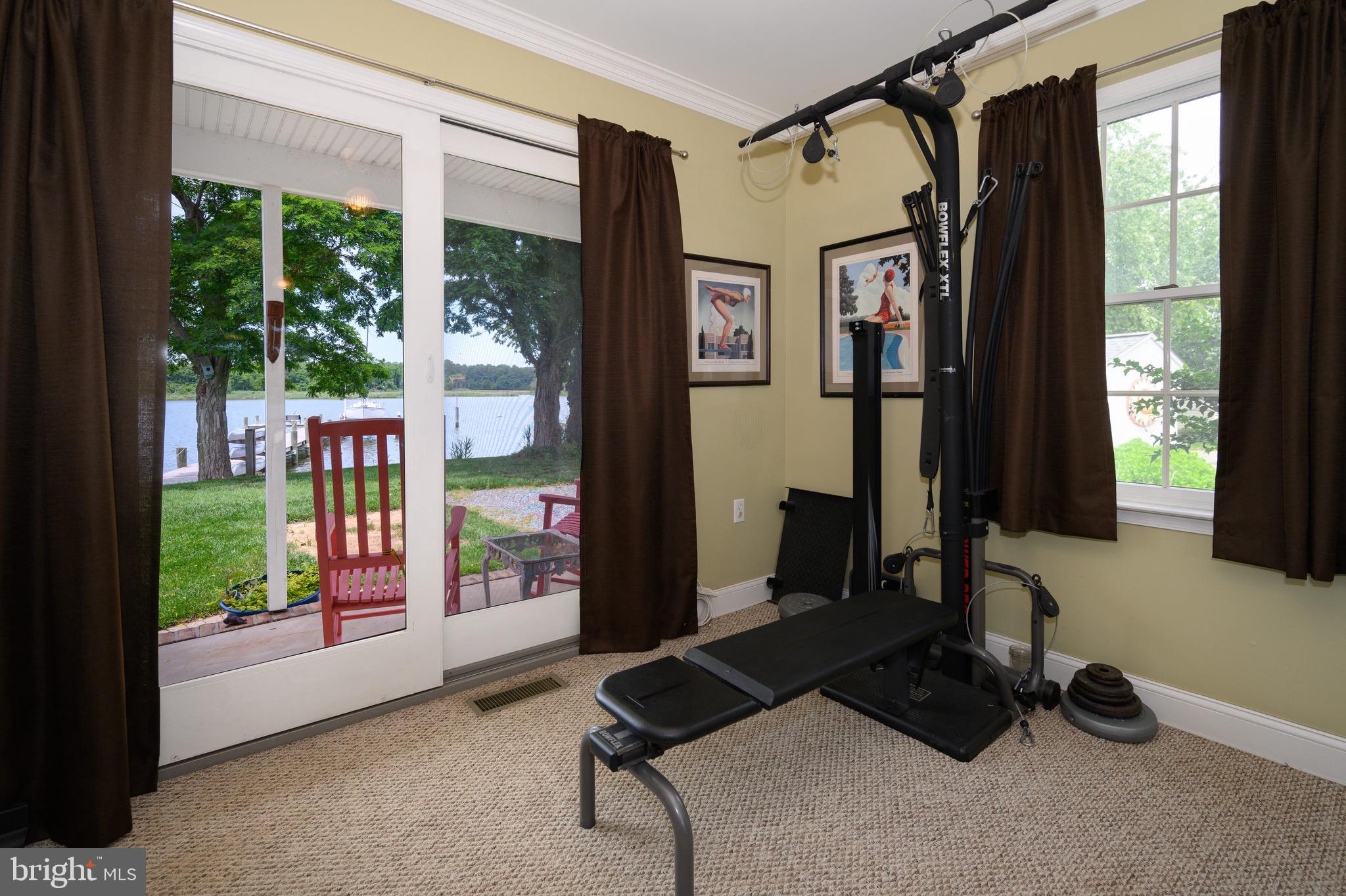 1606 Howard Road Chester, MD 21619 - Photo 22 of 54 a living room with furniture and a window