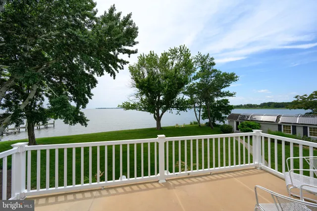 a balcony with trees in front of it