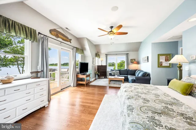 a spacious bathroom with a double vanity sink a mirror and a bathtub