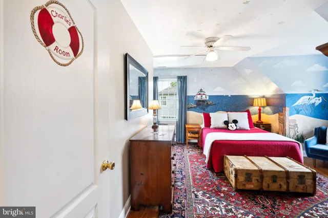 a bed room with two beds and a chandelier