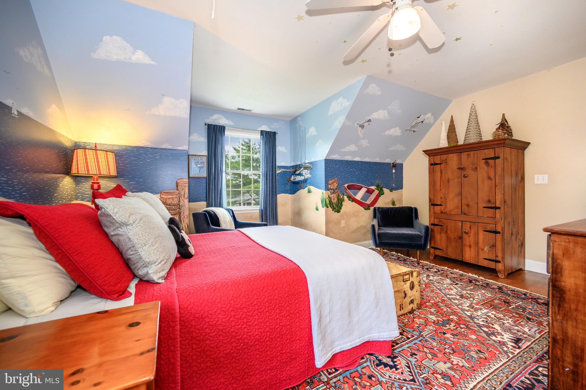 1606 Howard Road Chester, MD 21619 - Photo 33 of 54 a bed room with two beds and a chandelier