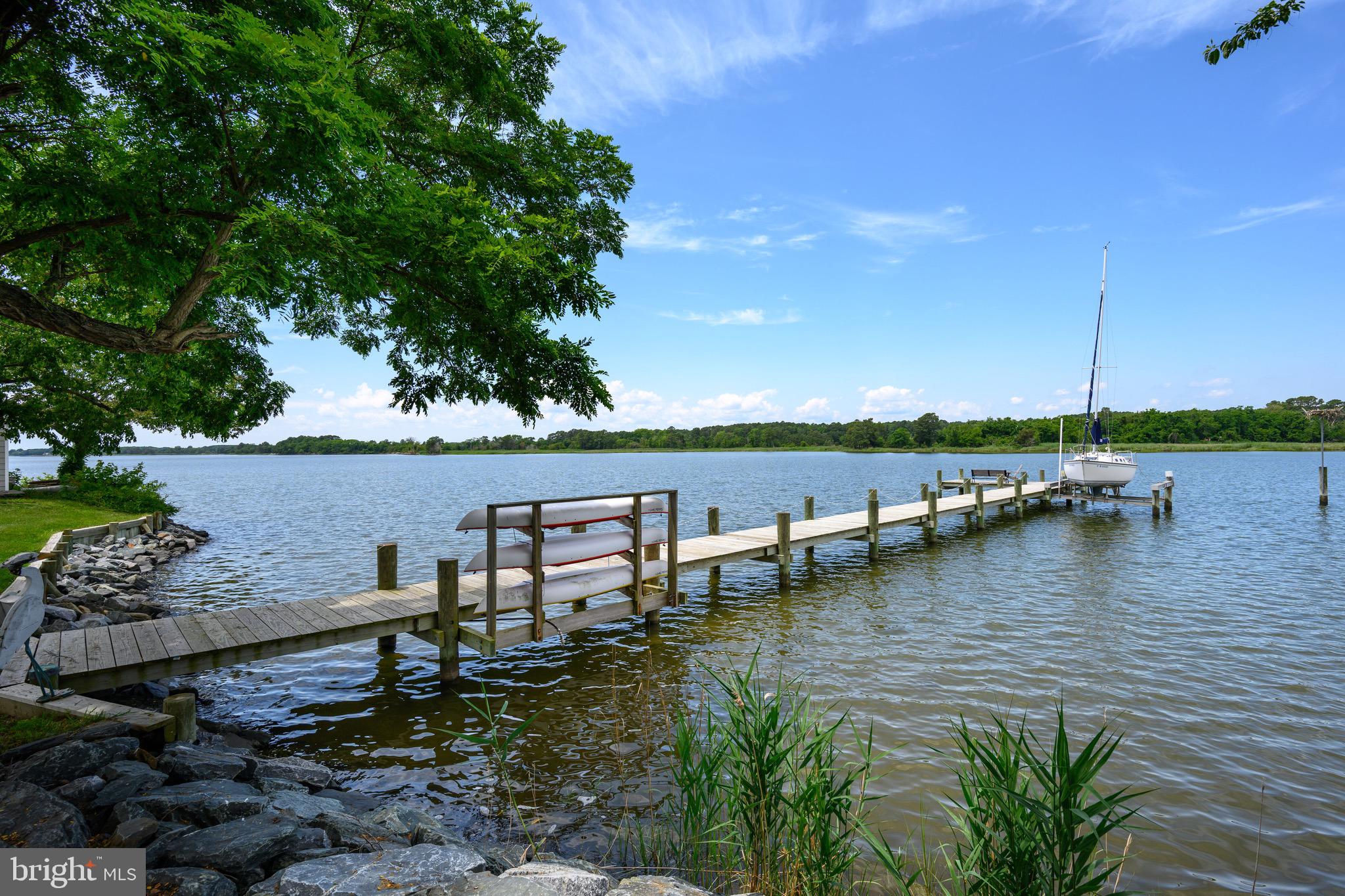 1606 Howard Road Chester, MD 21619 - Photo 38 of 54 a view of a lake with lawn chairs
