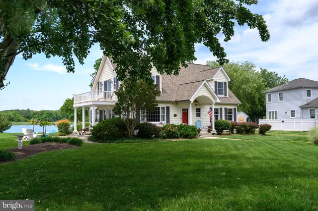a aerial view of a house with swimming pool and garden