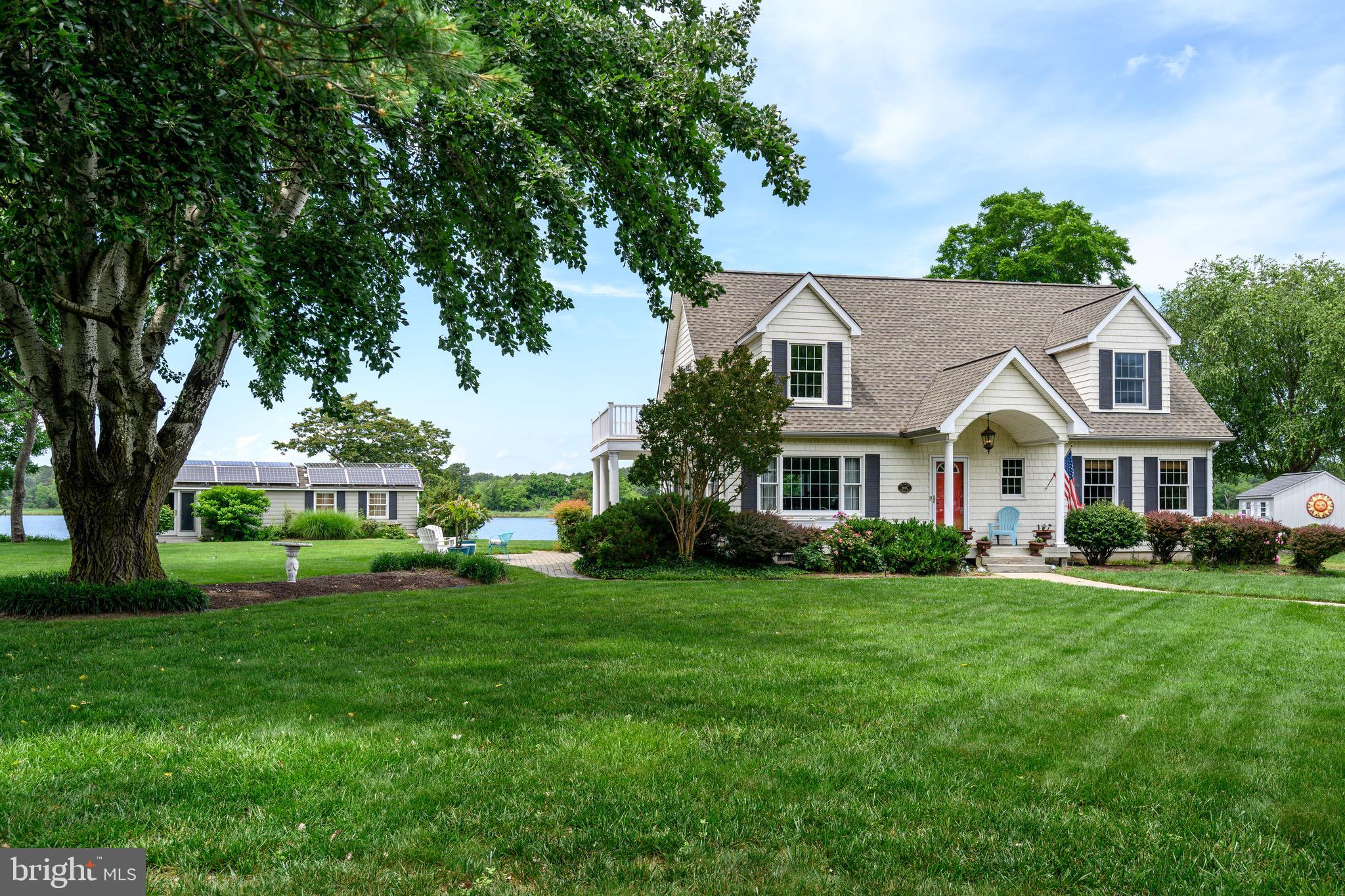 1606 Howard Road Chester, MD 21619 - Photo 43 of 54 a front view of a house with a garden