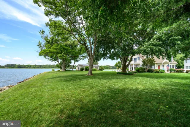 a view of a patio with garden and sitting area