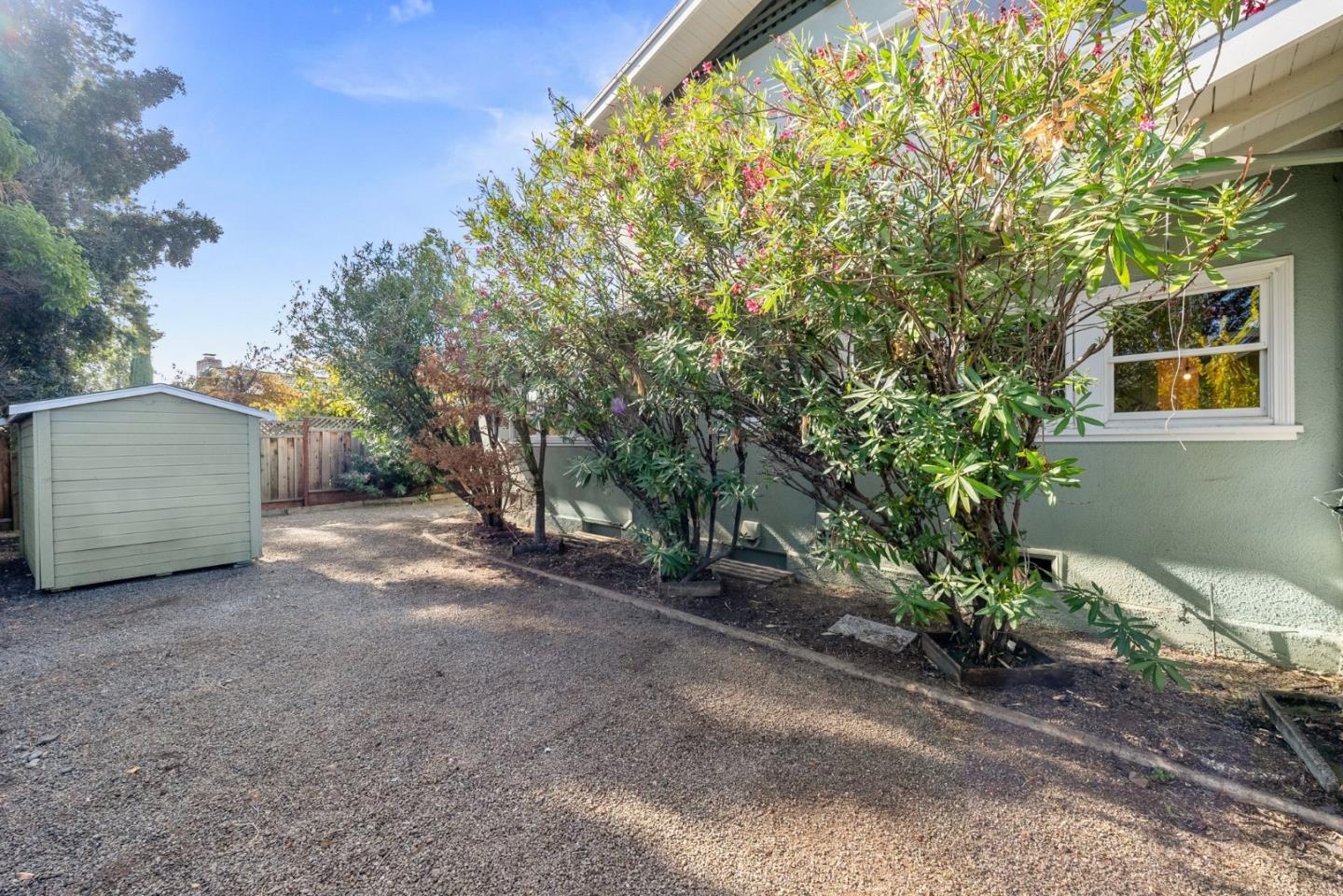 20724 Prospect Road Saratoga, CA 95070 - Photo 21 of 22 a view of a house with a large tree and plants