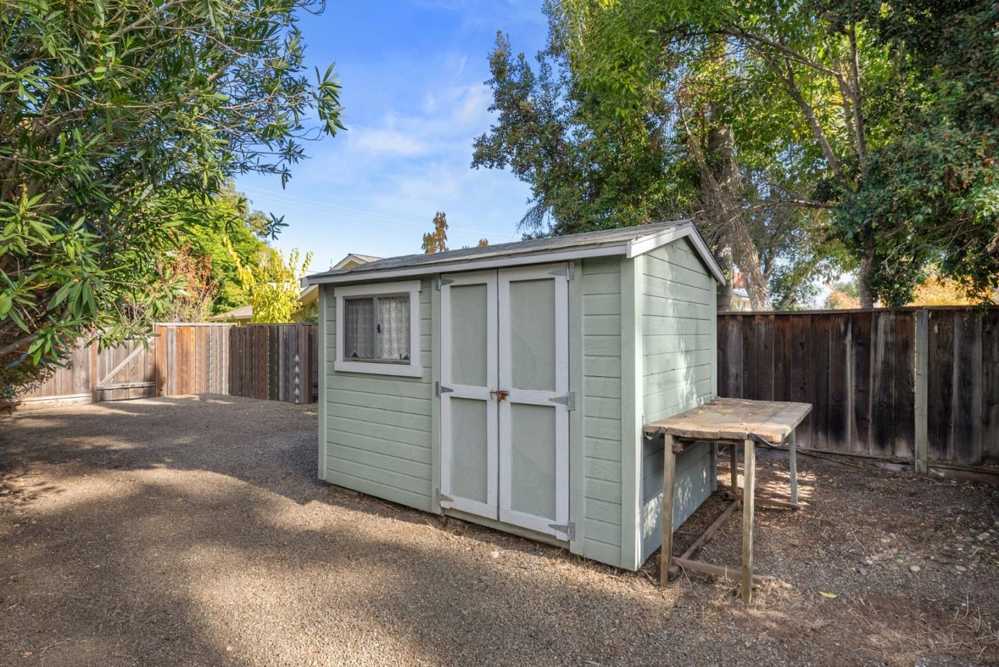 20724 Prospect Road Saratoga, CA 95070 - Photo 22 of 22 a view of a chair and table in the back yard of the house