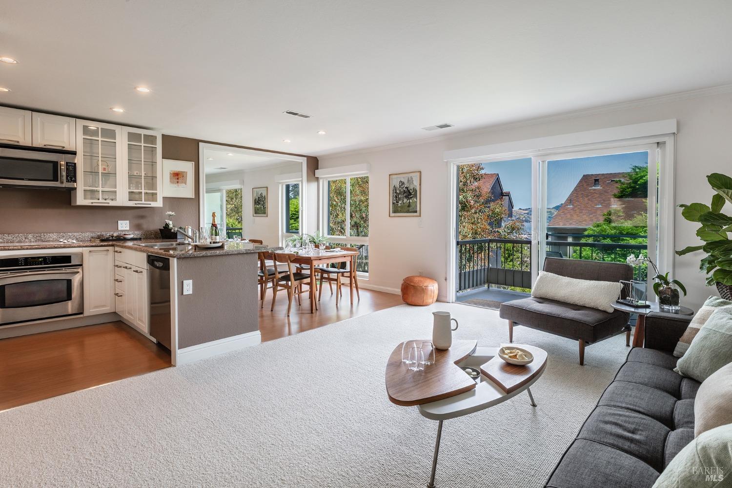 71 Anchorage Road Sausalito, CA 94965 - Photo 1 of 1 a living room with furniture kitchen view and a large window