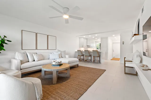 a kitchen with stainless steel appliances granite countertop a sink and a refrigerator