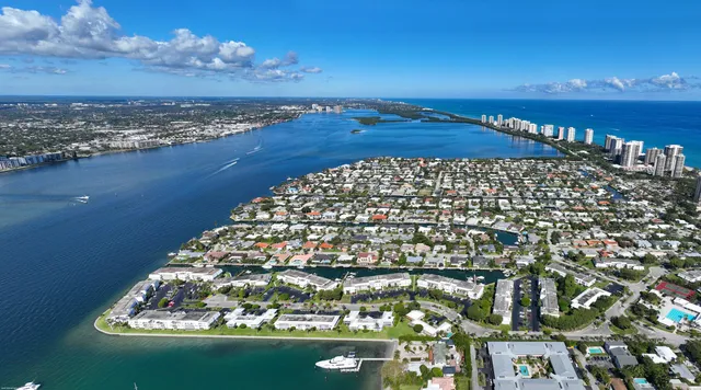 a view of a backyard with plants and outdoor seating