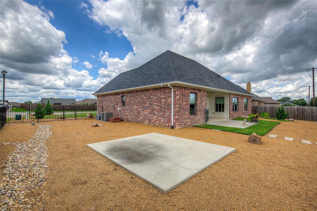 326 Koby Circle Sulphur Springs, TX 75482 - Photo 36 of 38 An additional concrete pad is ready for a dining area, hot tub, or even a storage shed.