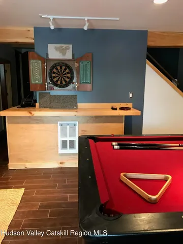 a bed sitting in a bedroom next to a blue wall