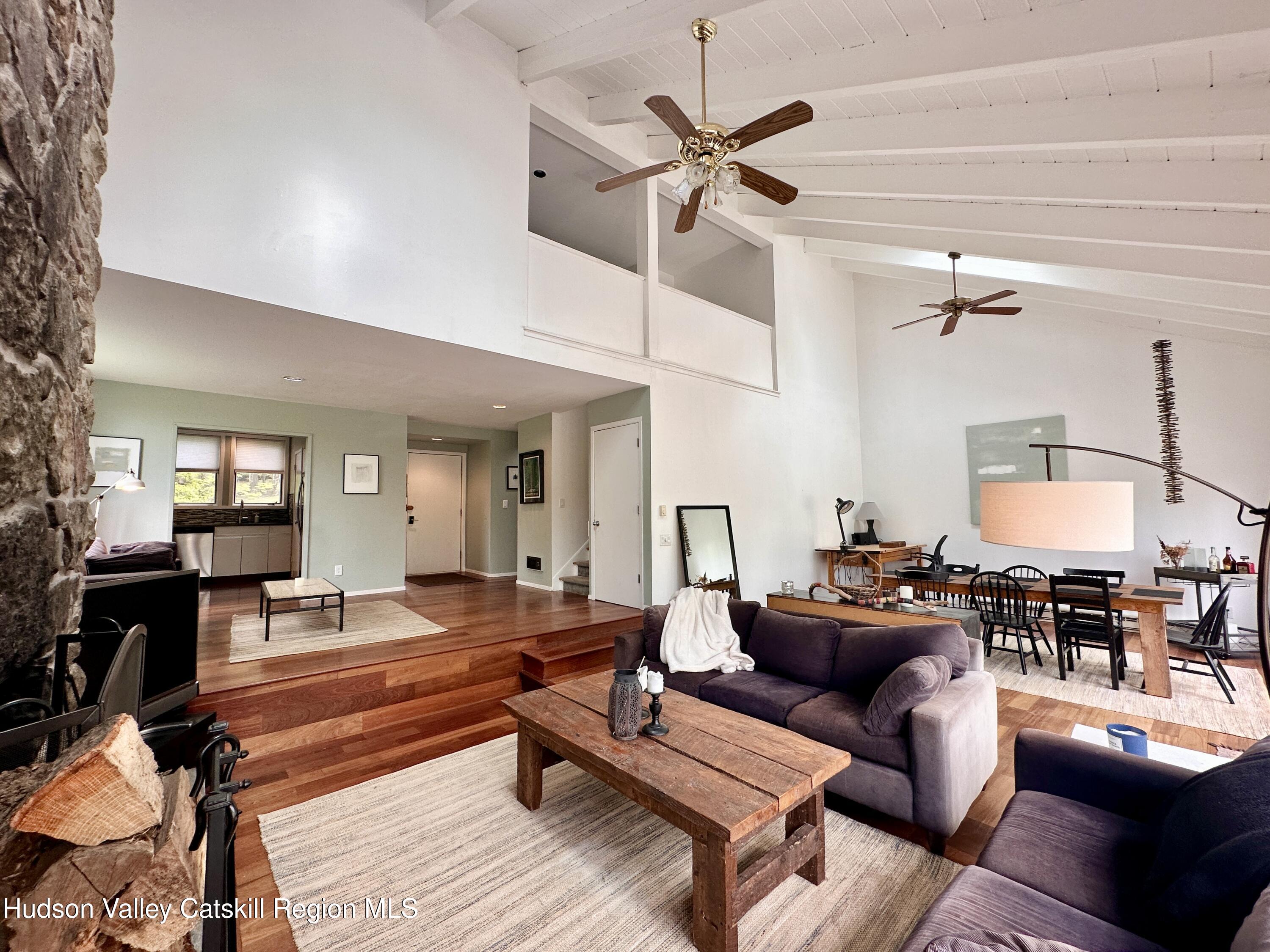270 Pines Drive, Unit 92 Roxbury, NY 12421 - Photo 6 of 31 a living room with furniture and wooden floor