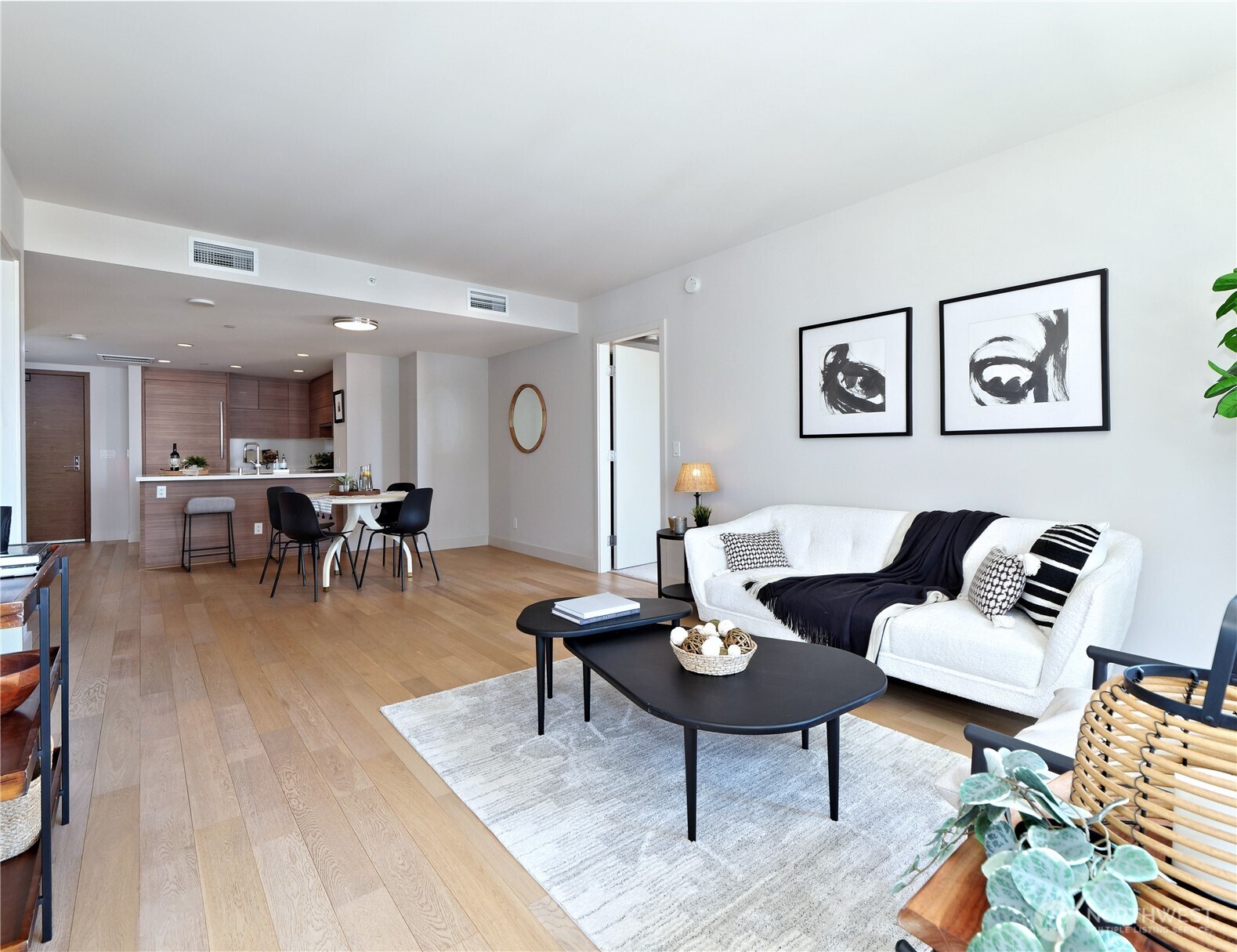 583 Battery Street, Unit 704N Seattle, WA 98121 - Photo 11 of 36 a living room with furniture and wooden floor