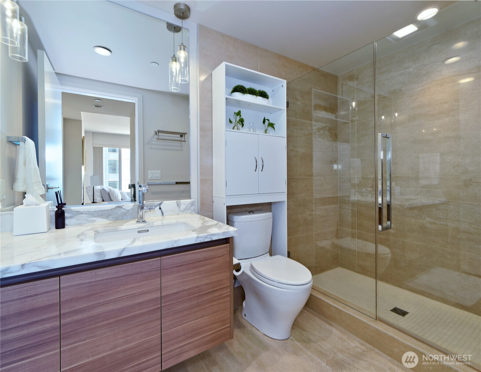 583 Battery Street, Unit 704N Seattle, WA 98121 - Photo 15 of 36 a bathroom with a sink a toilet and shower