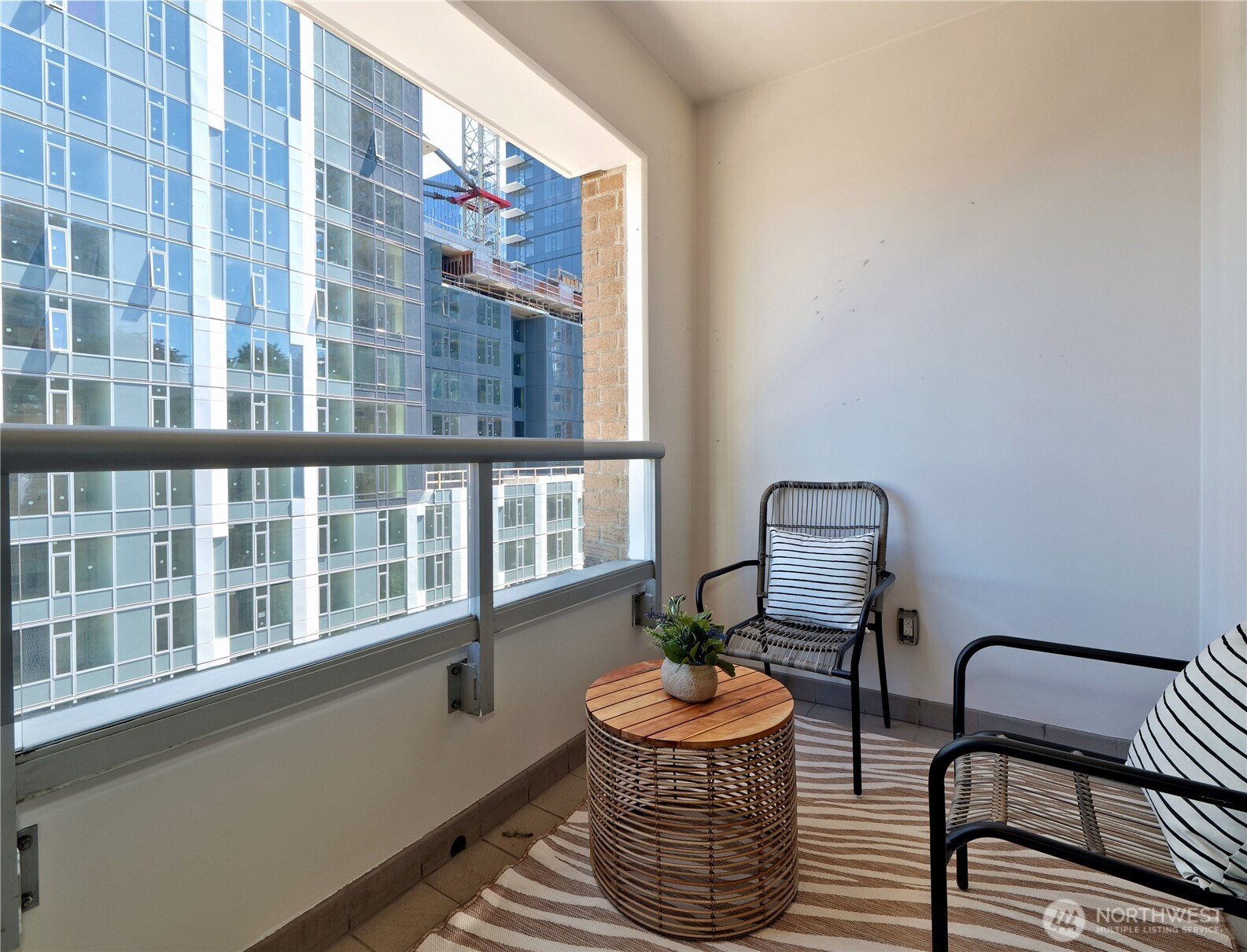 583 Battery Street, Unit 704N Seattle, WA 98121 - Photo 19 of 36 a living room with furniture and a window