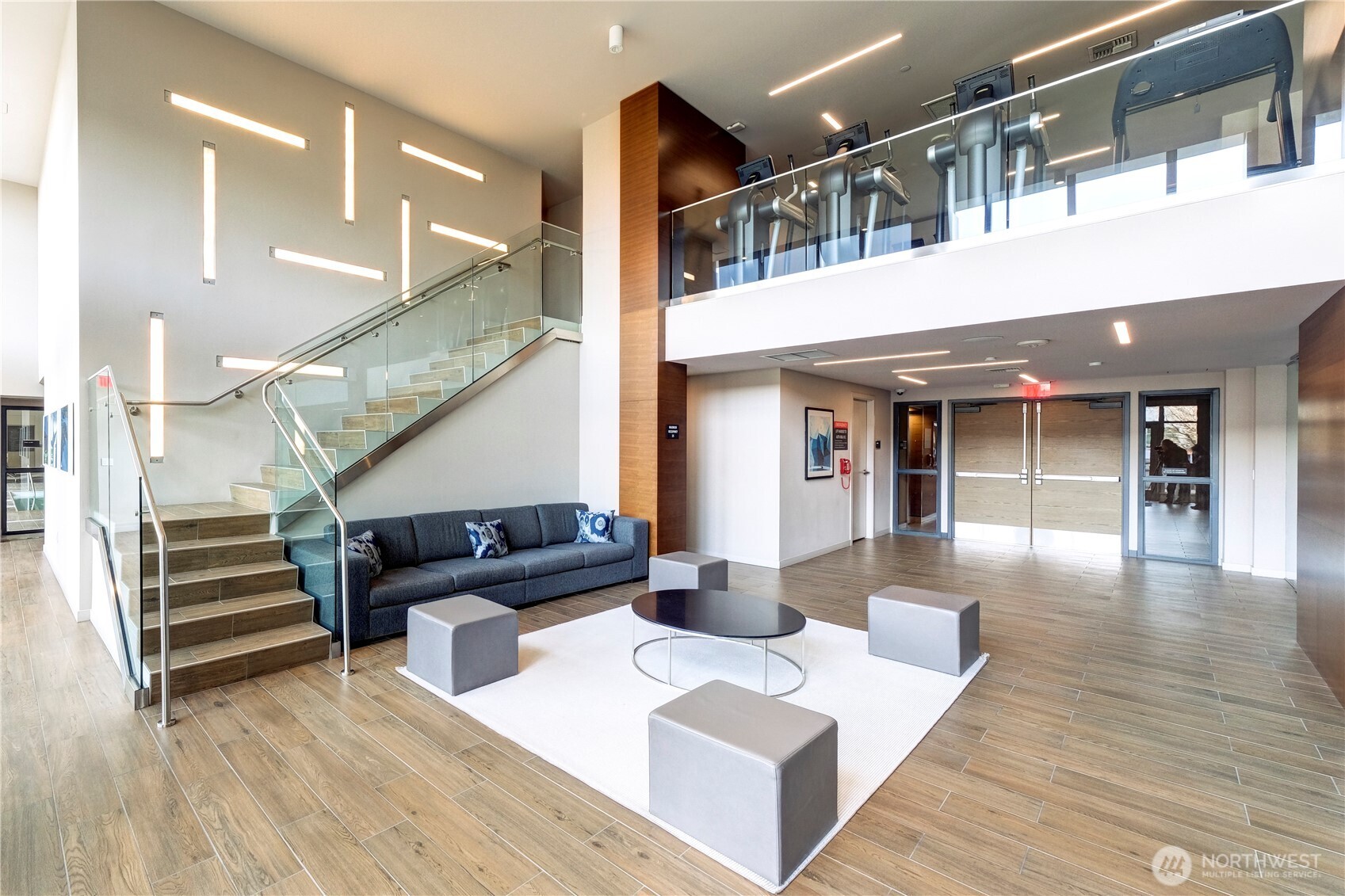 583 Battery Street, Unit 704N Seattle, WA 98121 - Photo 24 of 36 a living room with furniture and wooden floor