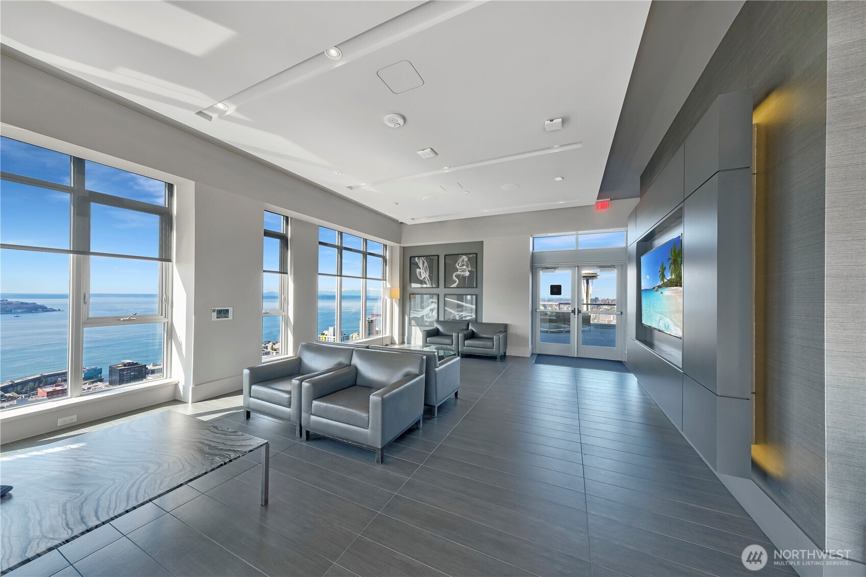 583 Battery Street, Unit 704N Seattle, WA 98121 - Photo 31 of 36 a living room with furniture and large windows