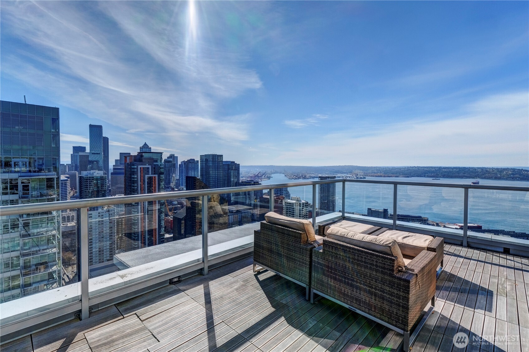 583 Battery Street, Unit 704N Seattle, WA 98121 - Photo 32 of 36 a view of a roof deck with couches and wooden floor