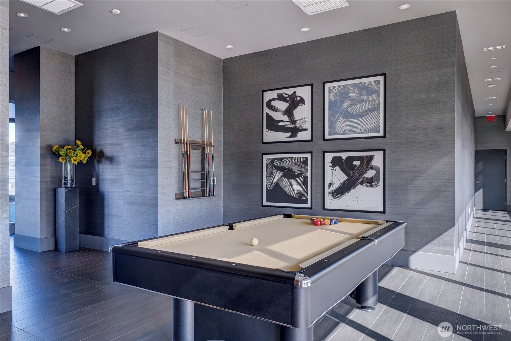 583 Battery Street, Unit 704N Seattle, WA 98121 - Photo 33 of 36 a room with pool table and paintings on the wall