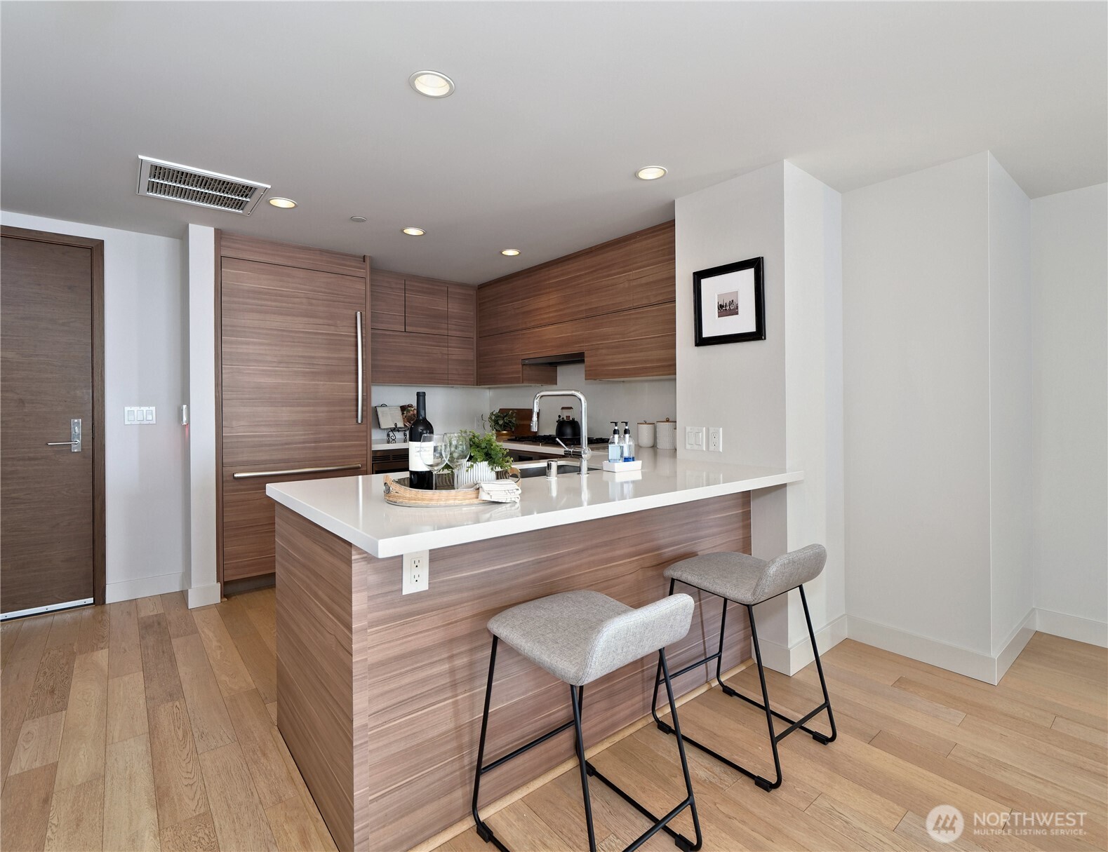 583 Battery Street, Unit 704N Seattle, WA 98121 - Photo 4 of 36 a kitchen with a table and chairs in it