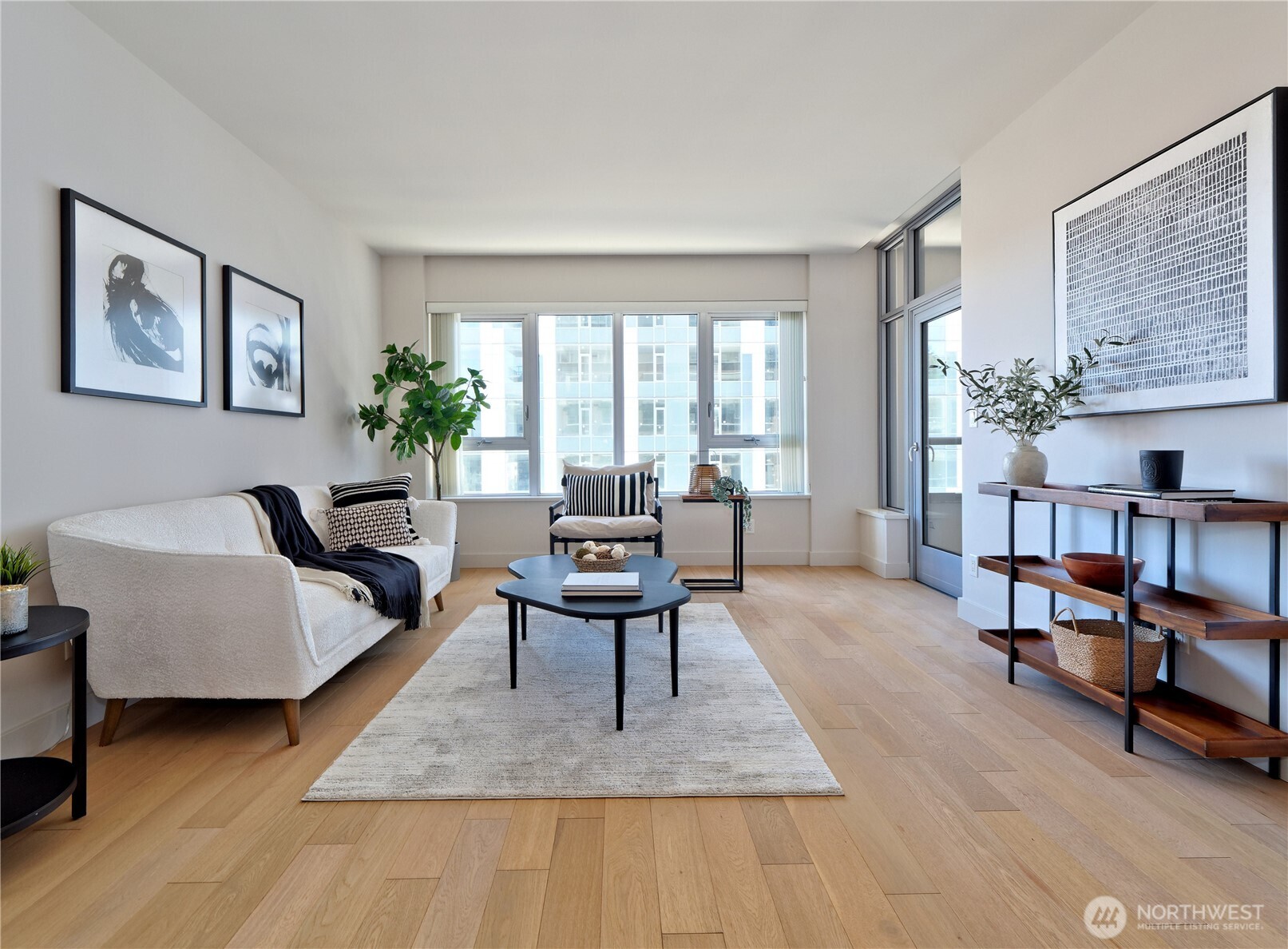 583 Battery Street, Unit 704N Seattle, WA 98121 - Photo 8 of 36 a living room with furniture and a wooden floor