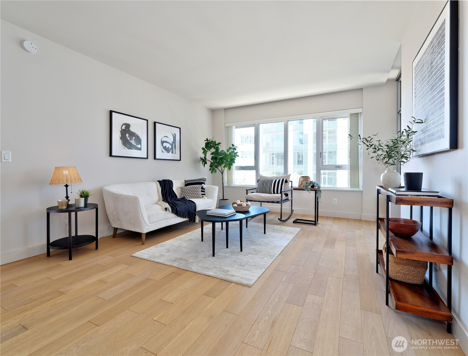 583 Battery Street, Unit 704N Seattle, WA 98121 - Photo 9 of 36 a living room with furniture and a window