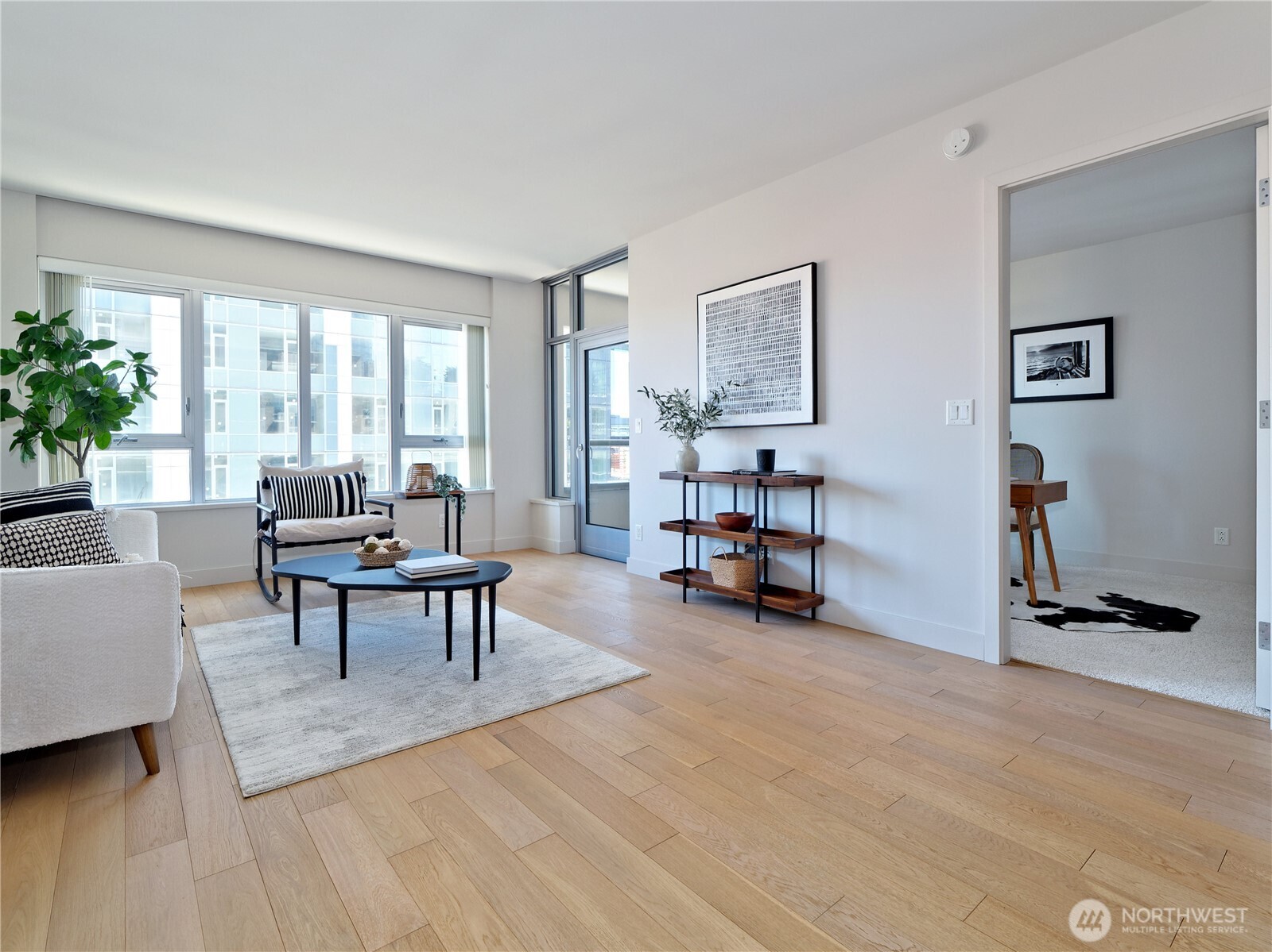 583 Battery Street, Unit 704N Seattle, WA 98121 - Photo 10 of 36 a living room with furniture and a large window