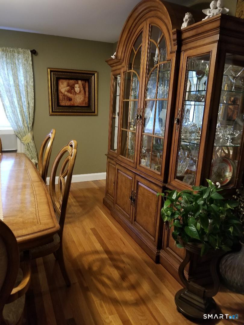 103 Windsor Street Enfield, CT 06082 - Photo 18 of 22 a view of staircase with furniture and a potted plant