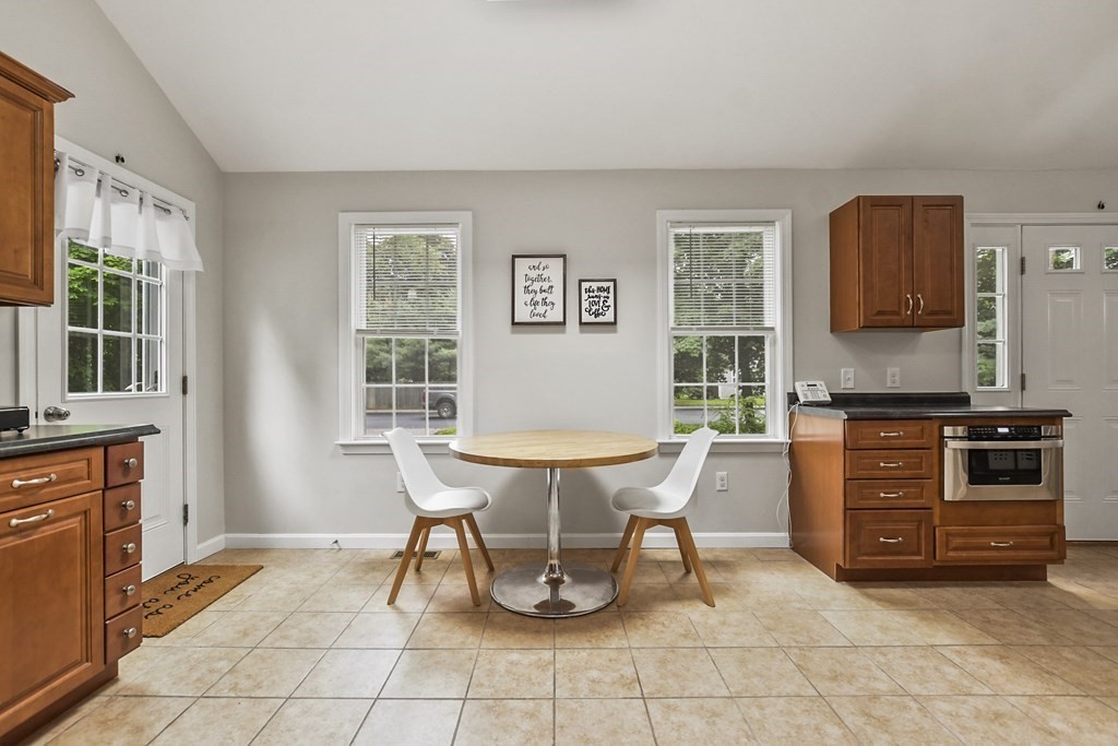 305 North Main Street Raynham, MA 02767 - Photo 13 of 38 a living room with furniture a window and a table