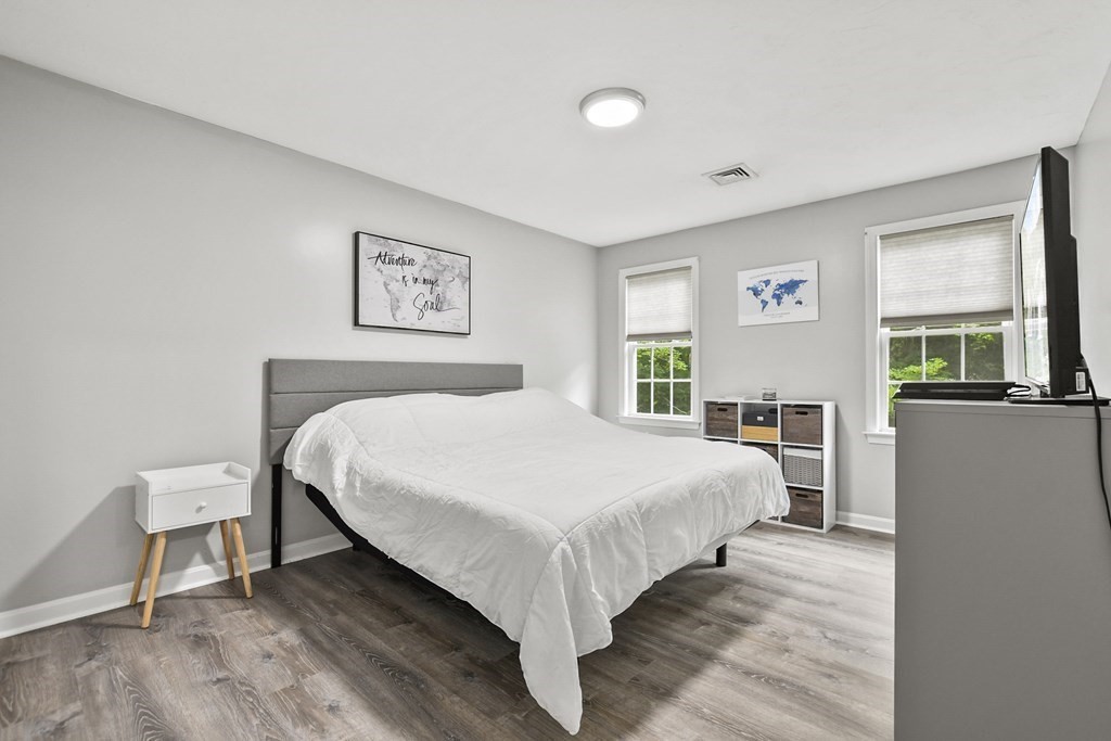 305 North Main Street Raynham, MA 02767 - Photo 15 of 38 a bed room with a bed and a chair
