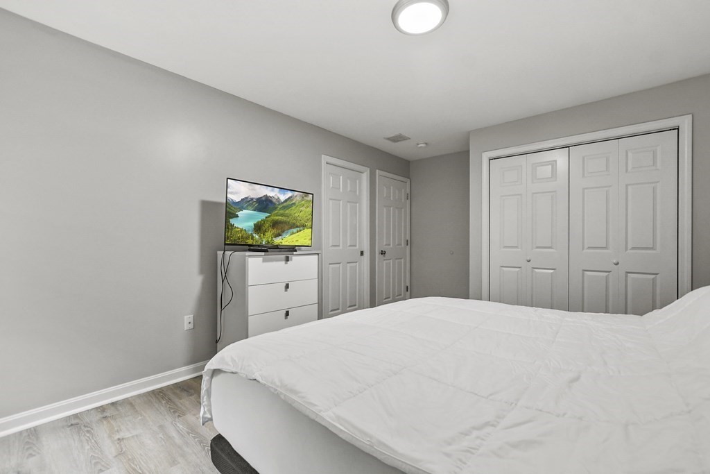 305 North Main Street Raynham, MA 02767 - Photo 17 of 38 a bedroom with a bed and a window