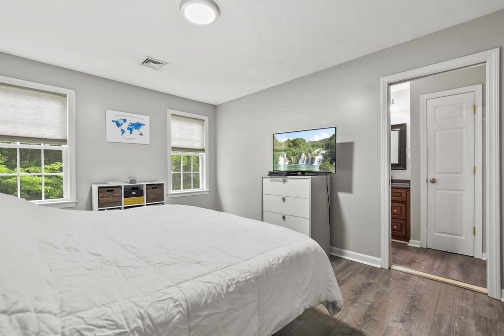 305 North Main Street Raynham, MA 02767 - Photo 18 of 38 a bedroom with a bed and a window