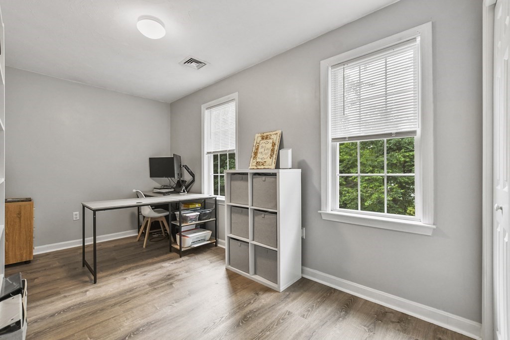 305 North Main Street Raynham, MA 02767 - Photo 21 of 38 a view of a workspace with furniture and a window