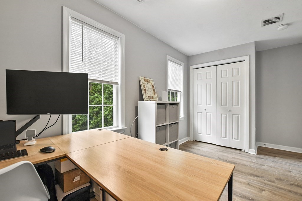 305 North Main Street Raynham, MA 02767 - Photo 22 of 38 a view of a workspace with furniture and a flat screen tv
