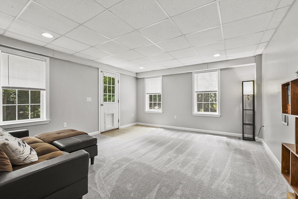 305 North Main Street Raynham, MA 02767 - Photo 23 of 38 a living room with furniture and windows