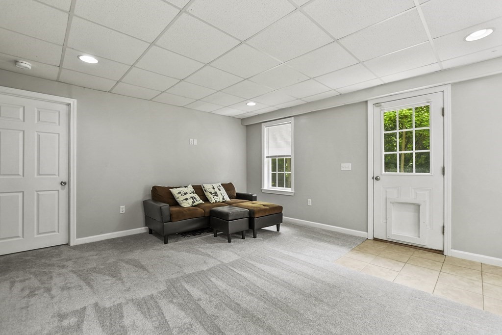 305 North Main Street Raynham, MA 02767 - Photo 24 of 38 a living room with furniture and a window