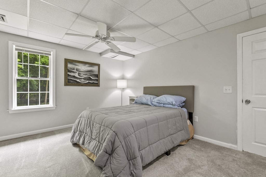 305 North Main Street Raynham, MA 02767 - Photo 27 of 38 a bedroom with a bed and a window