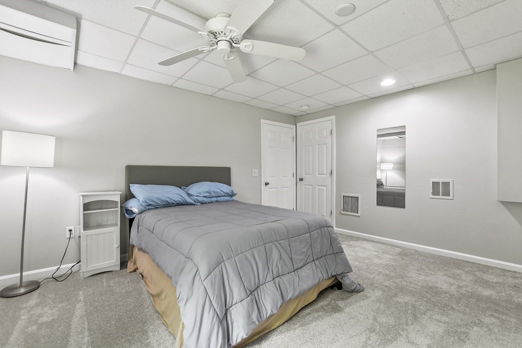 305 North Main Street Raynham, MA 02767 - Photo 28 of 38 a spacious bedroom with a bed and a window