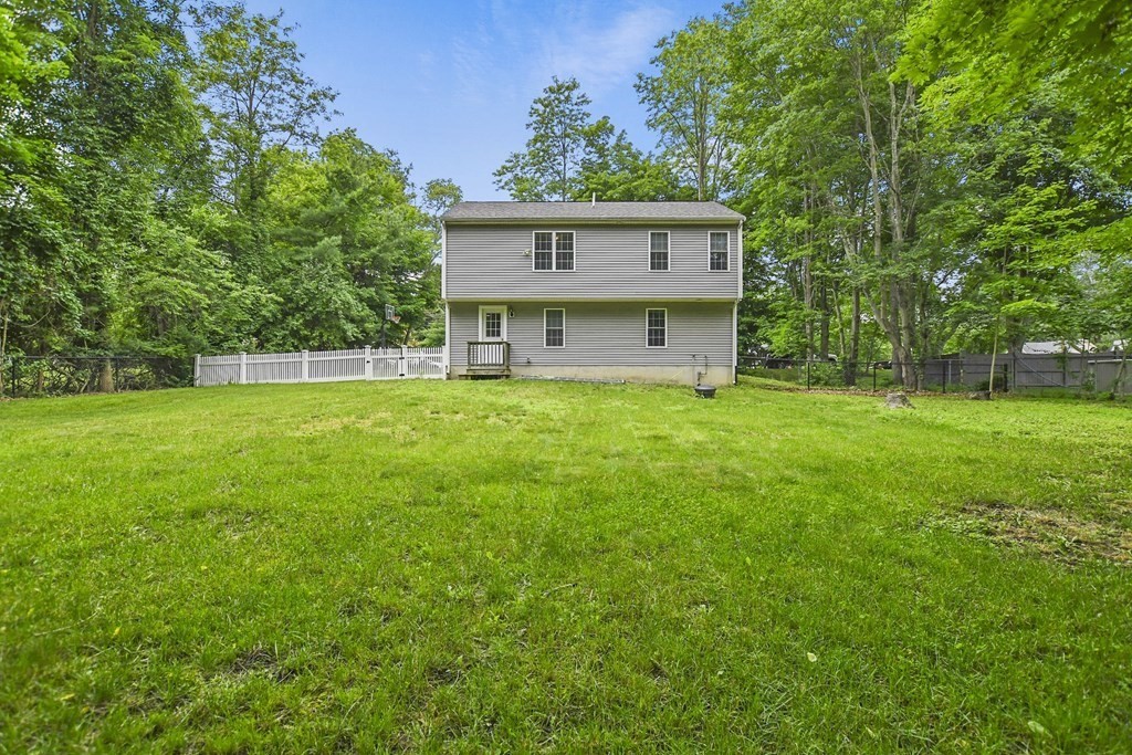 305 North Main Street Raynham, MA 02767 - Photo 32 of 38 a view of a house with a backyard