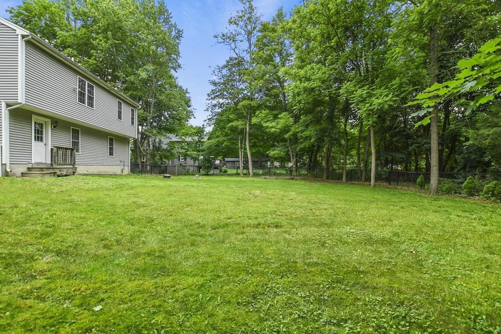 305 North Main Street Raynham, MA 02767 - Photo 34 of 38 a view of a backyard with a small cabin
