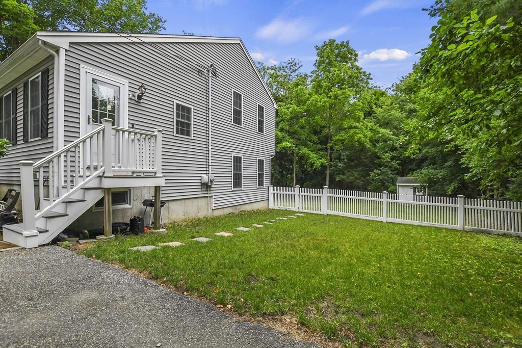 305 North Main Street Raynham, MA 02767 - Photo 35 of 38 a view of a house with a yard