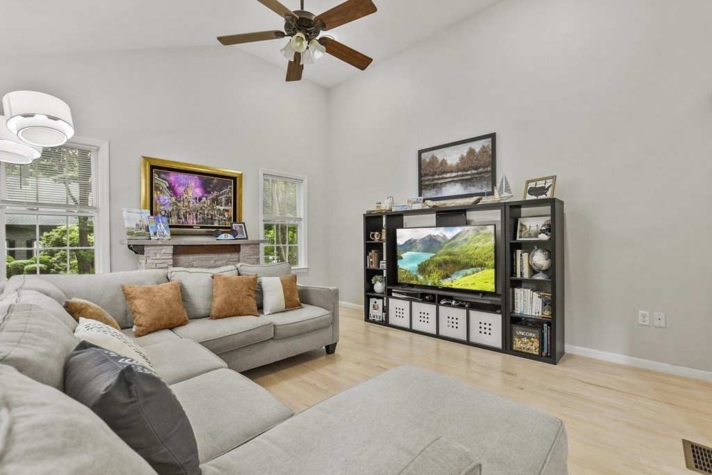 305 North Main Street Raynham, MA 02767 - Photo 4 of 38 a living room with furniture and a flat screen tv