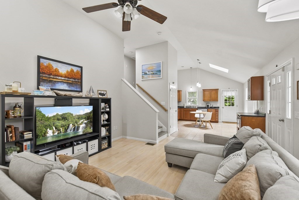 305 North Main Street Raynham, MA 02767 - Photo 7 of 38 a living room with furniture and a flat screen tv