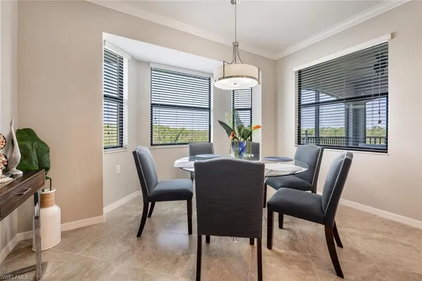 a view of a dining room with furniture window and outside view